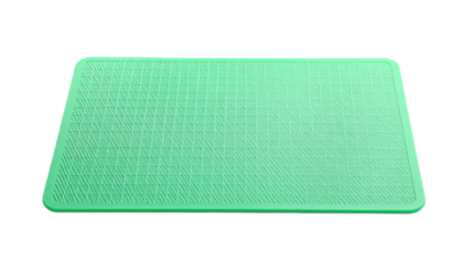 A mint green rectangular mat with a repeating diamond pattern is displayed.