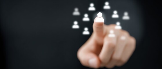 A person's hand, reaching out to select an avatar representing a choice within a network. Capturing the essence of selection.