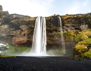 Powerful waterfall cascading down a dramatic cliff face