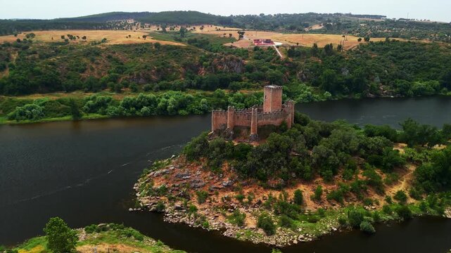 Drone orbit panorama shows Castelo de Almourol on Rio Tejo island, Santar&eacute;m, Portugal