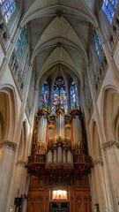 Fototapeta premium Cathedral interior, stained glass and pipe organ