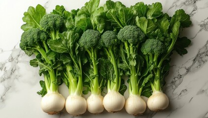 Fresh broccoli and turnips arranged on a white marble surface