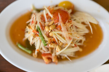 Spicy Papaya Salad. A vibrant and tantalizing papaya salad, brimming with fresh flavors and textures. A feast for the eyes with its vibrant colors