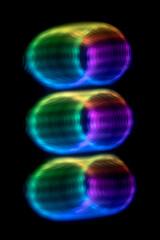 abstract defocused rainbow lights on dark background