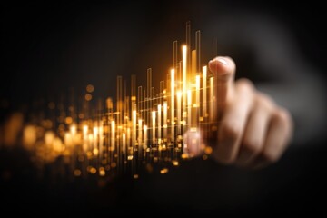 Hand touches glowing, golden data visualization