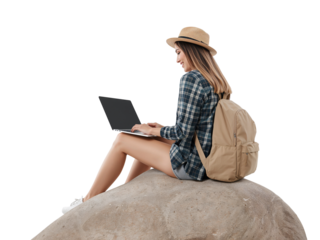 Young woman connecting with nature while working remotely using her laptop computer outdoor on the