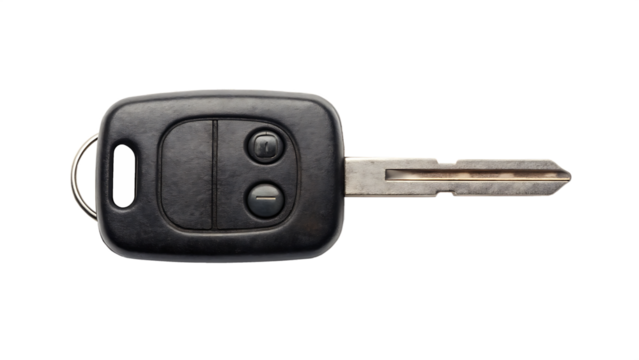 A car key with worn buttons and keychain loop