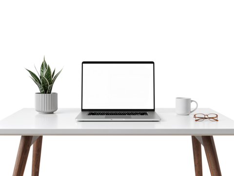 Minimalist home office setup with laptop, plant, coffee mug, and glasses on a white table on