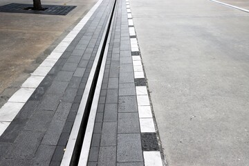 Steel drainage ditch along street perspective background