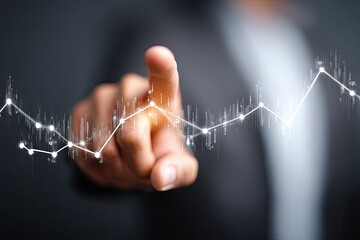 Hand points to upward trending graph