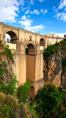 Obraz premium Ancient stone bridge over a deep gorge