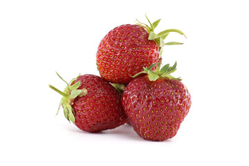 Three vibrant strawberries are stacked together, displaying their freshness.