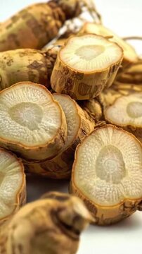 Dried ginseng slices isolated on plain background. herbal medicine concept. Fresh ginseng slices. Chinese ginseng root. Ginger slice. organic herbal. wellness food. Tiongkok traditional remedy. 