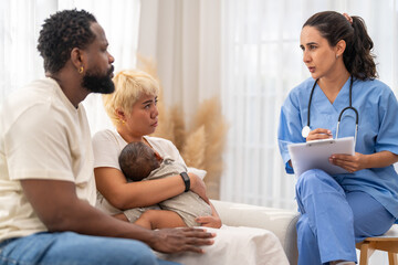 Obraz premium African baby health checkup with doctor pediatrician explaining results to parents, asian mother and african father, family healthcare consultation, childhood health, hospital service, insurance plan