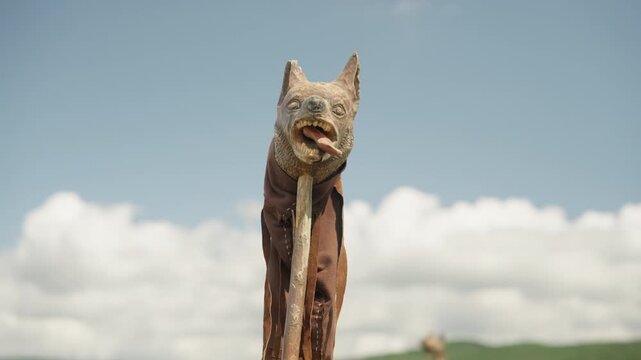 A cinematic, low-angle shot orbits the iconic Dacian Draco. The camera circles the bronze wolf-headed battle standard, revealing its fierce details against the sky.