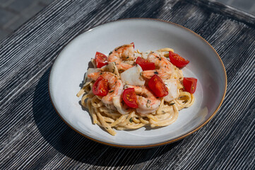 Pasta with shrimp and tomatoes. 