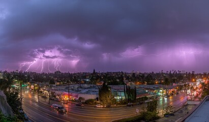 Fototapeta premium Panoramic view of a city street during a dramatic thunderstorm