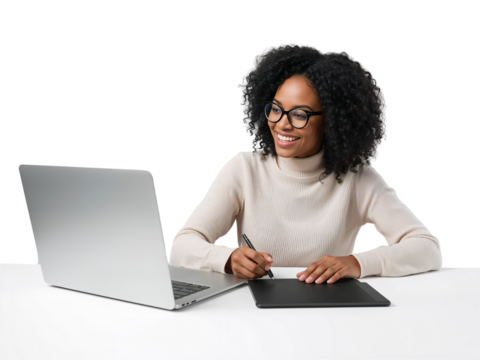 Focused digital artist working on a creative project with a tablet and laptop enjoying the