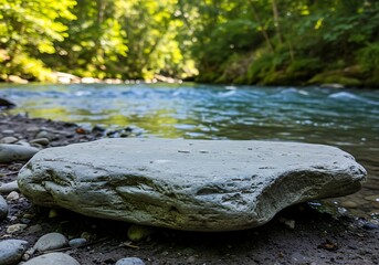 Mockup a large rock rests on the bank of a flowing river in nature commercial usage
