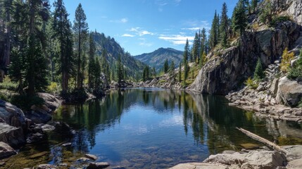 A beautiful lake surrounded by trees and mountains. The water is calm and clear, reflecting the sky and the trees. The scene is peaceful and serene, making it a perfect place to relax and enjoy nature