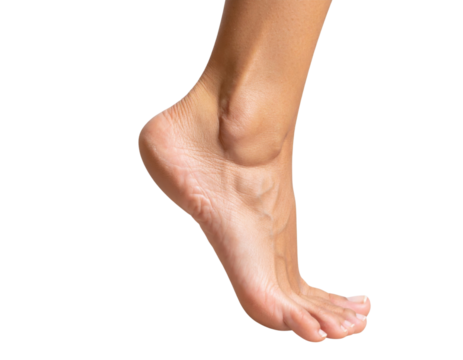 A close-up view of a human foot in a lifted position, showcasing its arch and toes in detail.