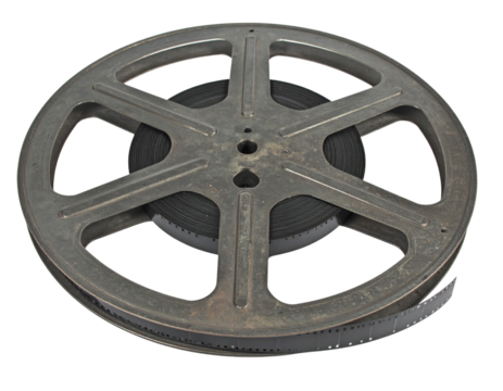 A vintage film reel showcasing a classic design, featuring a round metal frame and coiled film inside.
