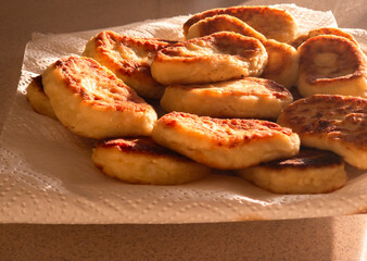 Delicious golden brown homemade pies resting on kitchen paper