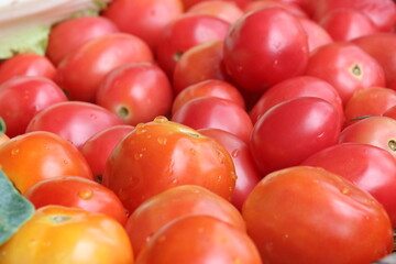 Ripe tomatoes in a fresh vegetable shop