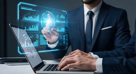 Fototapeta premium Businessman working on a laptop with digital interface overlay