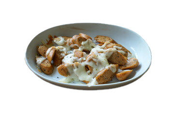 Isolated of baked cheesy sausages on white ceramic bowl