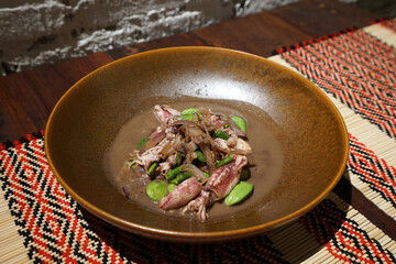 Close up plate of Stir fry squid with bitter beans