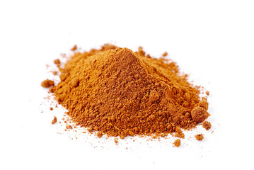 Pile of nutmeg powder isolated on white background