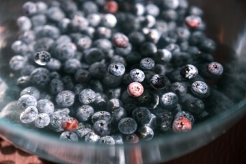 Close-up of fresh blueberries in water. A superfood rich in vitamins, minerals, antioxidants, and dietary fiber. Promotes digestion, boosts immunity, and supports a healthy lifestyle.