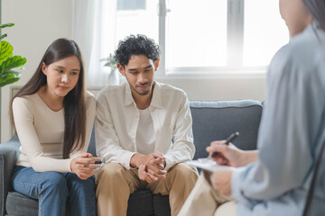 Spouses relationship consultant concept, Married couple listen to psychologist  during therapy talk...