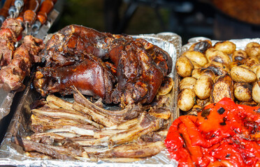 A variety of meats and vegetables are displayed on a table
