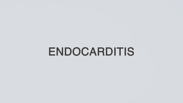 Endocarditis word diagnosed with a stethoscope held in hand on a white background, illustrating heart valve infection, medical evaluation, healthcare concept, and patient awareness
