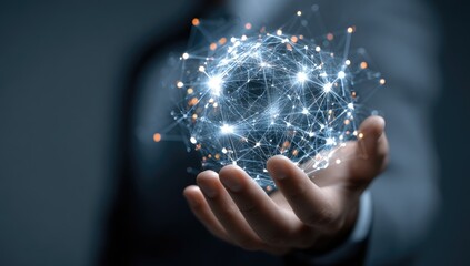 A hand holding a digital network sphere
