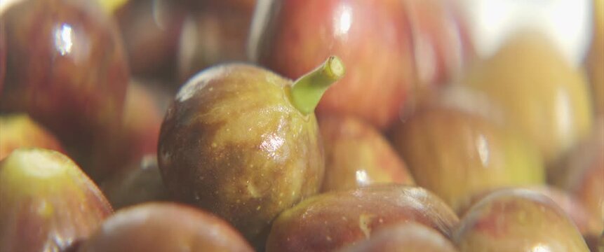 Pile of common figs on plate 4K anamorphic video