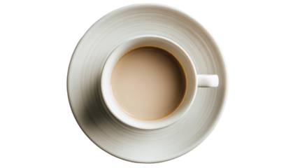 Overhead view of a creamy coffee in a white ceramic cup and saucer.