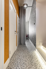 Modern Hallway with Textured Wallpaper and Bright Lighting
