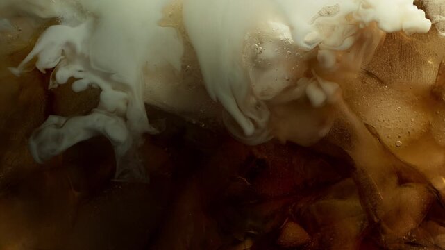 Super Slow Motion Shot of Pouring Cream into Coffe with Ice at 1000fps.
