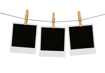 Instant photos on a string with clothespins, black picture frames, Isolated on transparent background.

