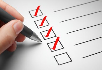 Hand checking boxes on a checklist