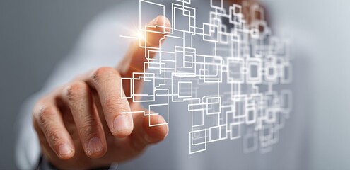 A hand interacts with a digital network of interconnected squares and lines