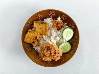 Delicious Indonesian Fried Chicken Rice Plate.