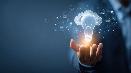 A businessman holds a glowing lightbulb, symbolizing innovation and cloud computing