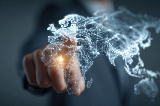 Hand pointing at a digital world map