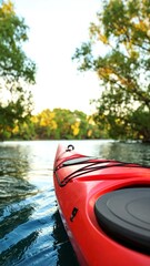 Fototapeta premium Red kayak on tranquil river