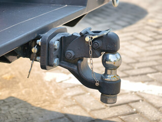 Close-up of a sturdy metal trailer hitch on a vehicle.