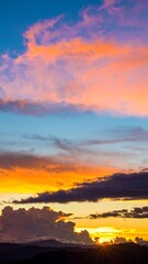 Colorful sunset sky over mountains